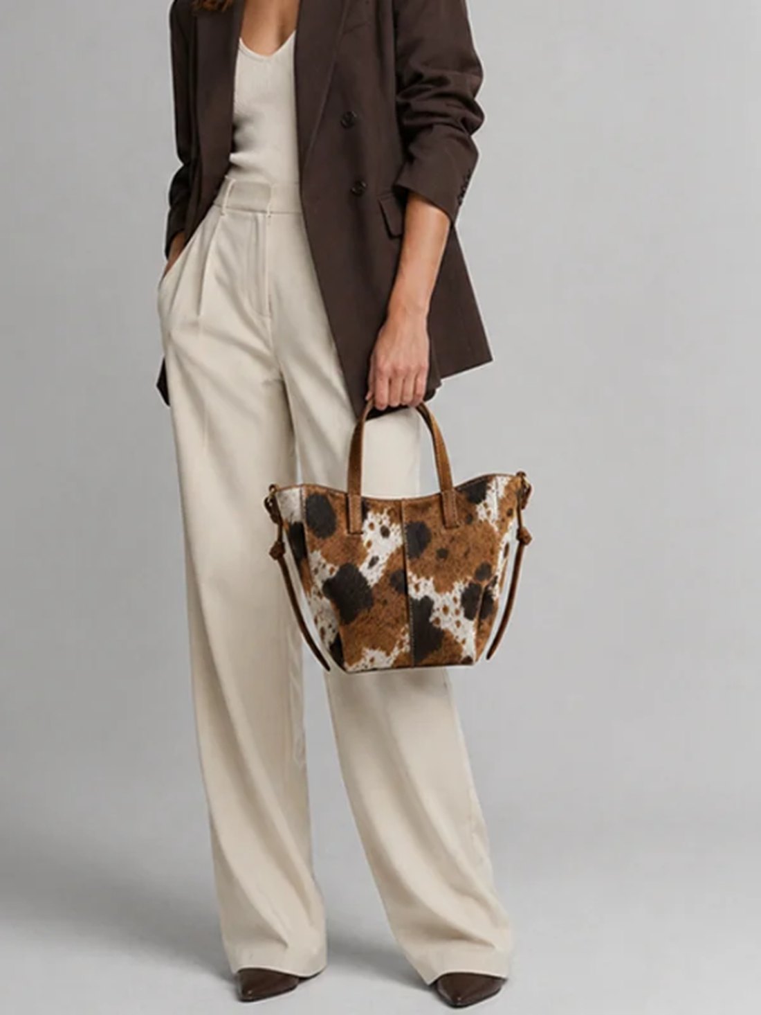 A tailored look carrying a printed leather tote